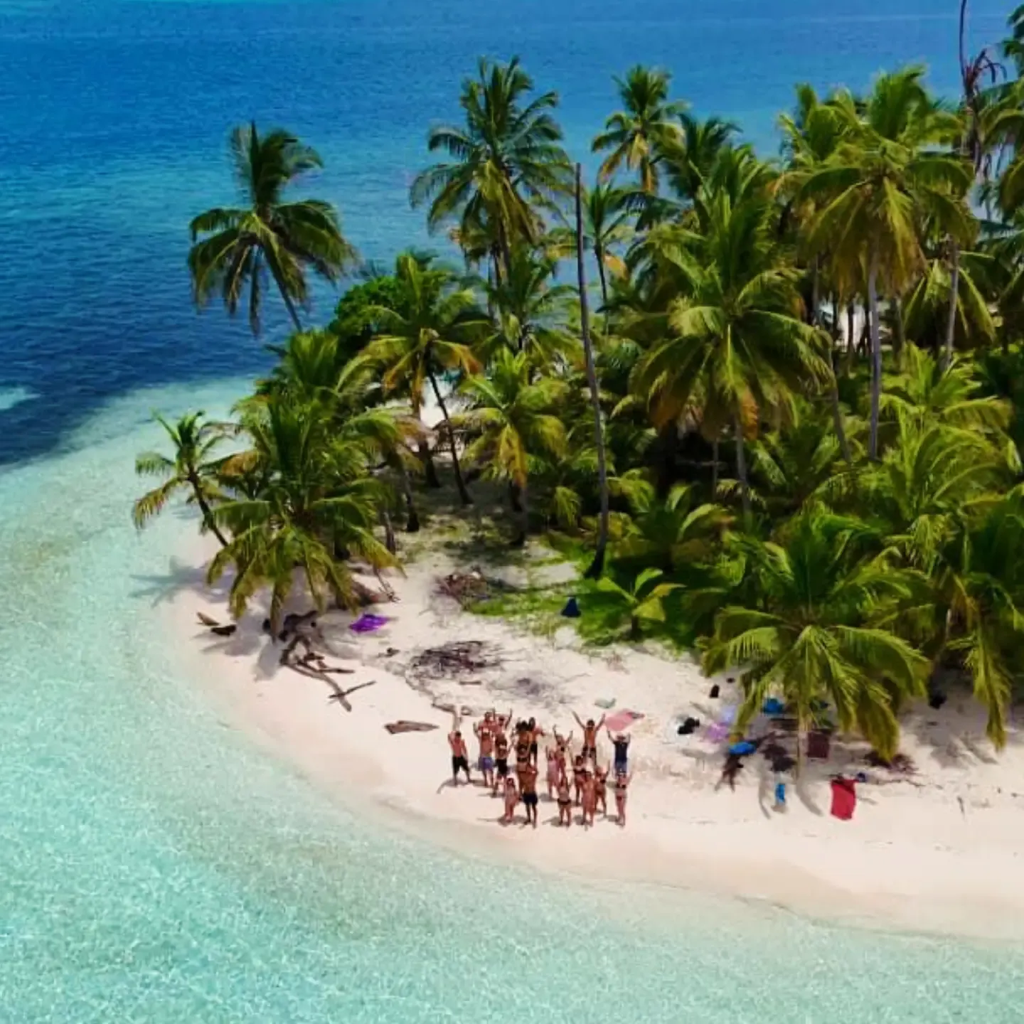 Aerial view of a palm island in San Blas with the Party Pirates group on the beach
