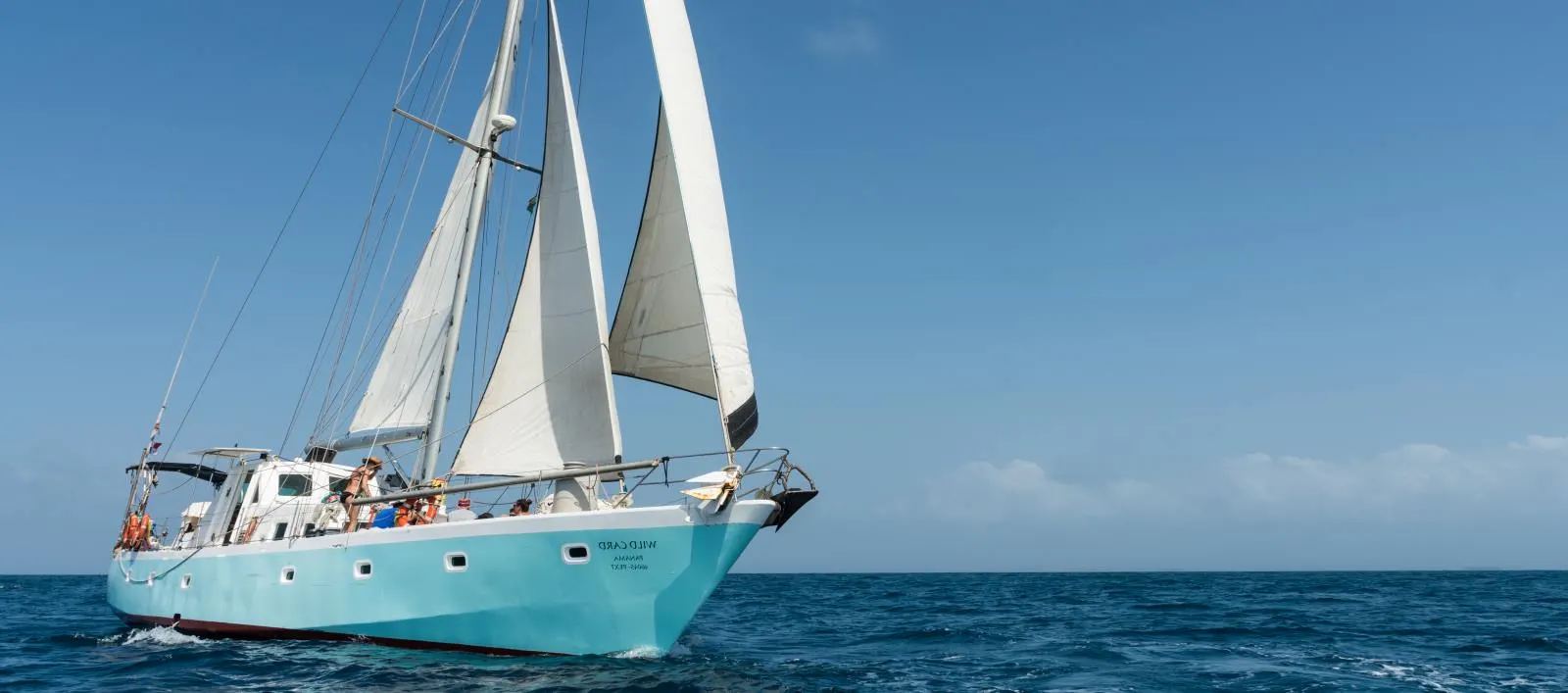 Wild Card steel sailboat sailing with full sails between Panama and Colombia